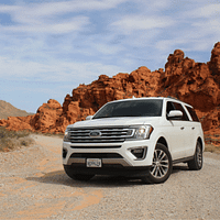 Car parked in a rocky mountains scene